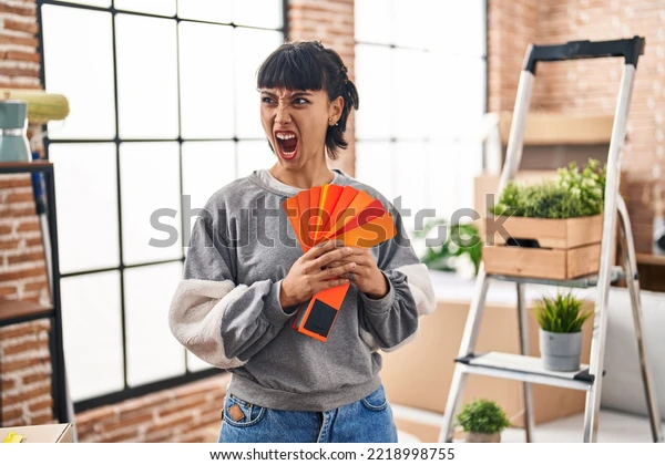 young-hispanic-woman-moving-new-600w-2218998755